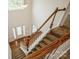 View of the entryway with hardwood and carpeted stairs and white trim at 4015 Amber Leigh Way Dr, Charlotte, NC 28269