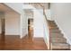 Bright foyer with hardwood floors, staircase, and elegant wainscoting at 4015 Amber Leigh Way Dr, Charlotte, NC 28269