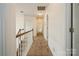 Long neutral-colored hallway with white walls, neutral carpet and recessed lighting on the second floor at 4015 Amber Leigh Way Dr, Charlotte, NC 28269