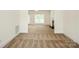 Open living room with neutral carpet and natural light near an exterior door and fireplace at 4015 Amber Leigh Way Dr, Charlotte, NC 28269