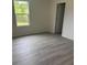 Cozy bedroom with a window offering a view of the outdoors and modern wood-look floors at 405 Webb Rd, Shelby, NC 28152