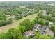 Overhead shot showcasing homes surrounded by abundant trees, adjacent to a scenic golf course at 407 Eastwood Dr, Salisbury, NC 28146