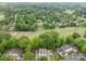 An aerial shot displays homes amidst lush greenery, creating a serene view of the residential area at 407 Eastwood Dr, Salisbury, NC 28146