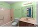 Bathroom featuring a shower-tub combination and vanity with a light green painted wall at 407 Eastwood Dr, Salisbury, NC 28146