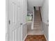 Entryway showcasing a staircase, hardwood floors, and a view into the living space at 407 Eastwood Dr, Salisbury, NC 28146
