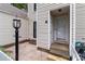 Close-up of the front entrance showcasing the house number and a classic light fixture at 407 Eastwood Dr, Salisbury, NC 28146