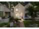 Charming townhome with a picket fence, lush garden, and a welcoming walkway to the front door at 407 Eastwood Dr, Salisbury, NC 28146