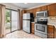 Bright kitchen with stainless steel appliances and a sliding glass door to the outside at 407 Eastwood Dr, Salisbury, NC 28146