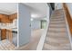 Open living space with a view of the kitchen and staircase, offering a bright and airy feel at 407 Eastwood Dr, Salisbury, NC 28146