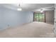 Spacious living room with a sliding door to the outdoor balcony, offering natural light and views at 407 Eastwood Dr, Salisbury, NC 28146