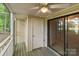 Enclosed porch featuring wood flooring, a ceiling fan, and sliding glass doors for indoor/outdoor living at 407 Eastwood Dr, Salisbury, NC 28146