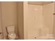 Bathroom with a toilet and a shower with white walls at 4304 Fletcher Funderburk Rd, Lancaster, SC 29720