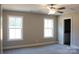 Neutral bedroom with carpet, ceiling fan, and two windows, perfect for relaxation at 4304 Fletcher Funderburk Rd, Lancaster, SC 29720