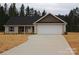 Charming single-story home features a two-car garage, concrete driveway, and newly landscaped yard at 4304 Fletcher Funderburk Rd, Lancaster, SC 29720