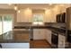 Modern kitchen features granite counters, stainless appliances, and bright white cabinetry at 4304 Fletcher Funderburk Rd, Lancaster, SC 29720