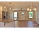 Open-concept kitchen with island, stainless steel appliances, and modern lighting fixtures at 4304 Fletcher Funderburk Rd, Lancaster, SC 29720