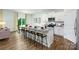 Open-concept kitchen with white cabinets, granite countertops, stainless steel appliances, and island seating at 4615 Harris Elliot Rd, Lincolnton, NC 28092