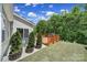 Inviting back deck ideal for outdoor entertaining with lush greenery at 5101 Helmsworth Dr, Waxhaw, NC 28173