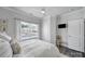 Serene bedroom with a large window and neutral tones, offering a comfortable and relaxing space at 5101 Helmsworth Dr, Waxhaw, NC 28173