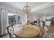 Dining area with sliding glass doors to outdoor patio space, open concept floor plan at 5101 Helmsworth Dr, Waxhaw, NC 28173