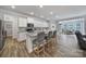 Kitchen featuring an island with bar seating, stainless steel appliances and hardwood floors at 5101 Helmsworth Dr, Waxhaw, NC 28173
