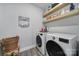 Convenient laundry room with modern washer and dryer and shelving at 5101 Helmsworth Dr, Waxhaw, NC 28173
