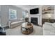 Cozy living room with fireplace, built-in shelving, and comfortable seating at 5101 Helmsworth Dr, Waxhaw, NC 28173