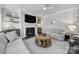 Comfortable living room with fireplace, TV, and built-in shelving at 5101 Helmsworth Dr, Waxhaw, NC 28173