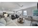 Spacious living room, with seating, open to the kitchen and dining room at 5101 Helmsworth Dr, Waxhaw, NC 28173