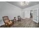 Sitting room with chairs, hardwood floors, and glass french doors at 5101 Helmsworth Dr, Waxhaw, NC 28173