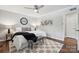 Comfortable bedroom showcasing a ceiling fan and a gray accent bench at 513 Inwood Dr, Charlotte, NC 28209
