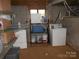 Basement area with washer, dryer, storage shelving, and utility connections at 5209 Markay St, Matthews, NC 28105
