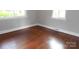 Bright bedroom featuring hardwood floors and natural light from two windows at 5209 Markay St, Matthews, NC 28105