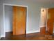 Bedroom with wood floors, large closet with sliding door, and neutral walls at 5209 Markay St, Matthews, NC 28105