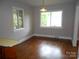 Bright dining room with hardwood floors, neutral walls, and natural light from two windows at 5209 Markay St, Matthews, NC 28105