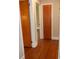 Hallway with hardwood floors and neutral walls leading to additional rooms, bright with natural light at 5209 Markay St, Matthews, NC 28105