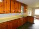 Cozy kitchen featuring warm wood cabinetry, ample counter space, and natural light at 5209 Markay St, Matthews, NC 28105