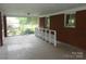 Spacious brick porch with white railing and views of the surrounding landscape at 5209 Markay St, Matthews, NC 28105