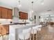 This contemporary kitchen features wooden cabinets, white countertops, and a stylish island with comfortable seating at 5644 Kingspan Dr, Charlotte, NC 28217