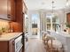 Modern kitchen with stainless steel appliances, center island with seating, and pendant lighting at 5644 Kingspan Dr, Charlotte, NC 28217