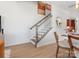 An elegant staircase with wooden rails and white banisters connects the levels of the home at 5644 Kingspan Dr, Charlotte, NC 28217
