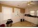 Bright kitchen with white cabinets and vinyl flooring at 615 Mauney Ave, Kings Mountain, NC 28086
