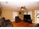 Cozy living area featuring hardwood floors, a ceiling fan, and neutral wall colors at 615 Mauney Ave, Kings Mountain, NC 28086