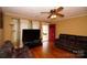 Inviting living room with hardwood floors and comfortable brown furniture at 615 Mauney Ave, Kings Mountain, NC 28086
