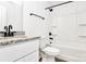 Bathroom featuring white vanity with granite countertop, modern faucet, and tub-shower combination at 624 W Kerr St, Salisbury, NC 28144