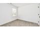 This bedroom is filled with light from the window and neutral carpet at 624 W Kerr St, Salisbury, NC 28144