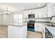 New kitchen featuring island with granite counters, stainless appliances, and white cabinets at 624 W Kerr St, Salisbury, NC 28144