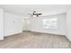 Bright living room with modern ceiling fan and natural light showcases open space with light colored, wood-look flooring at 624 W Kerr St, Salisbury, NC 28144