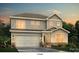 Charming two-story home showcasing a symmetrical facade and a two-car garage at 7073 Stella Pl, Stanley, NC 28164