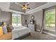 Comfortable bedroom with large windows and tray ceiling at 728 Palmers Pl, Rock Hill, SC 29730